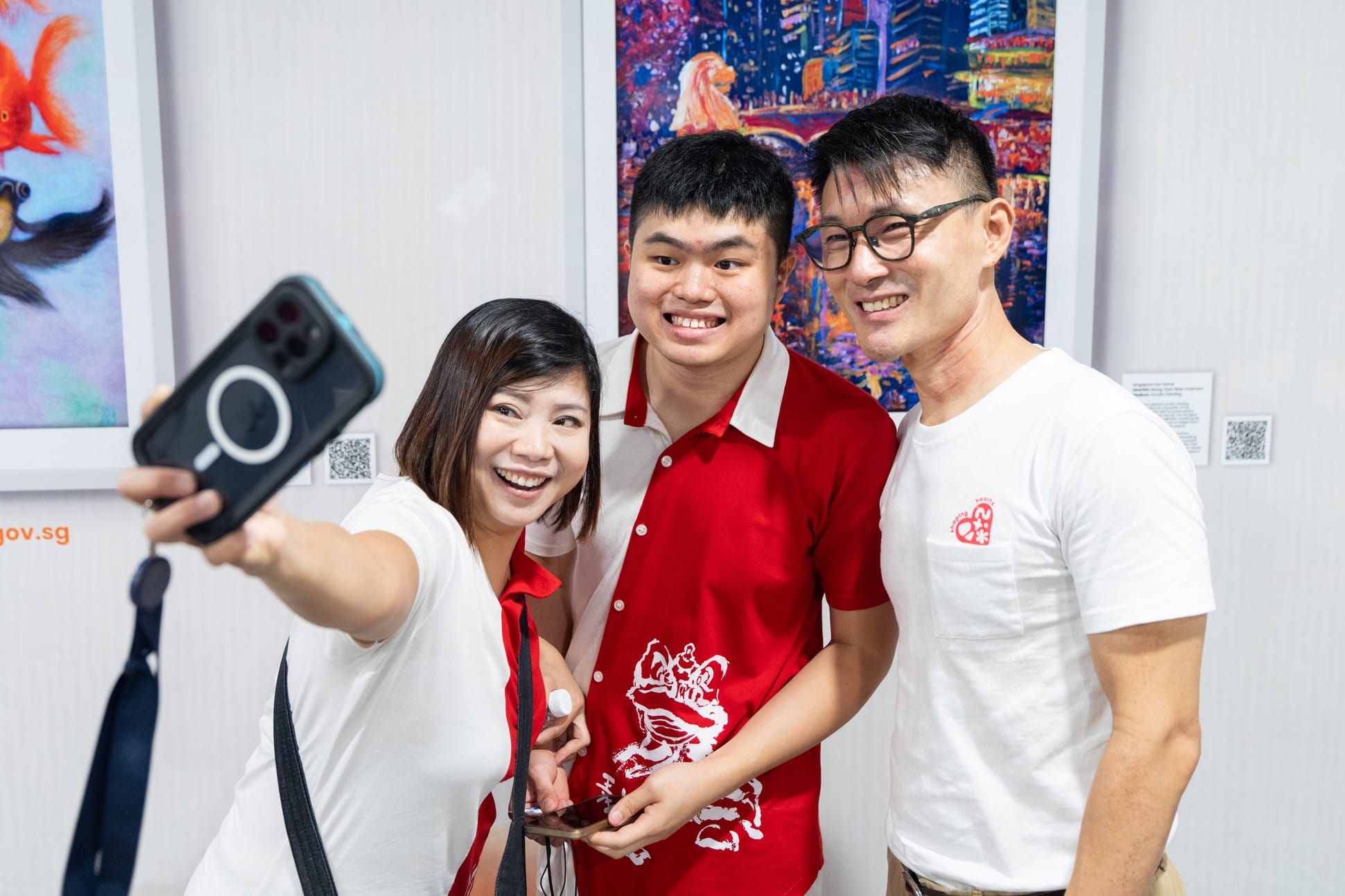 Mother and son taking a selfie with North East CDC Mayor Baey.